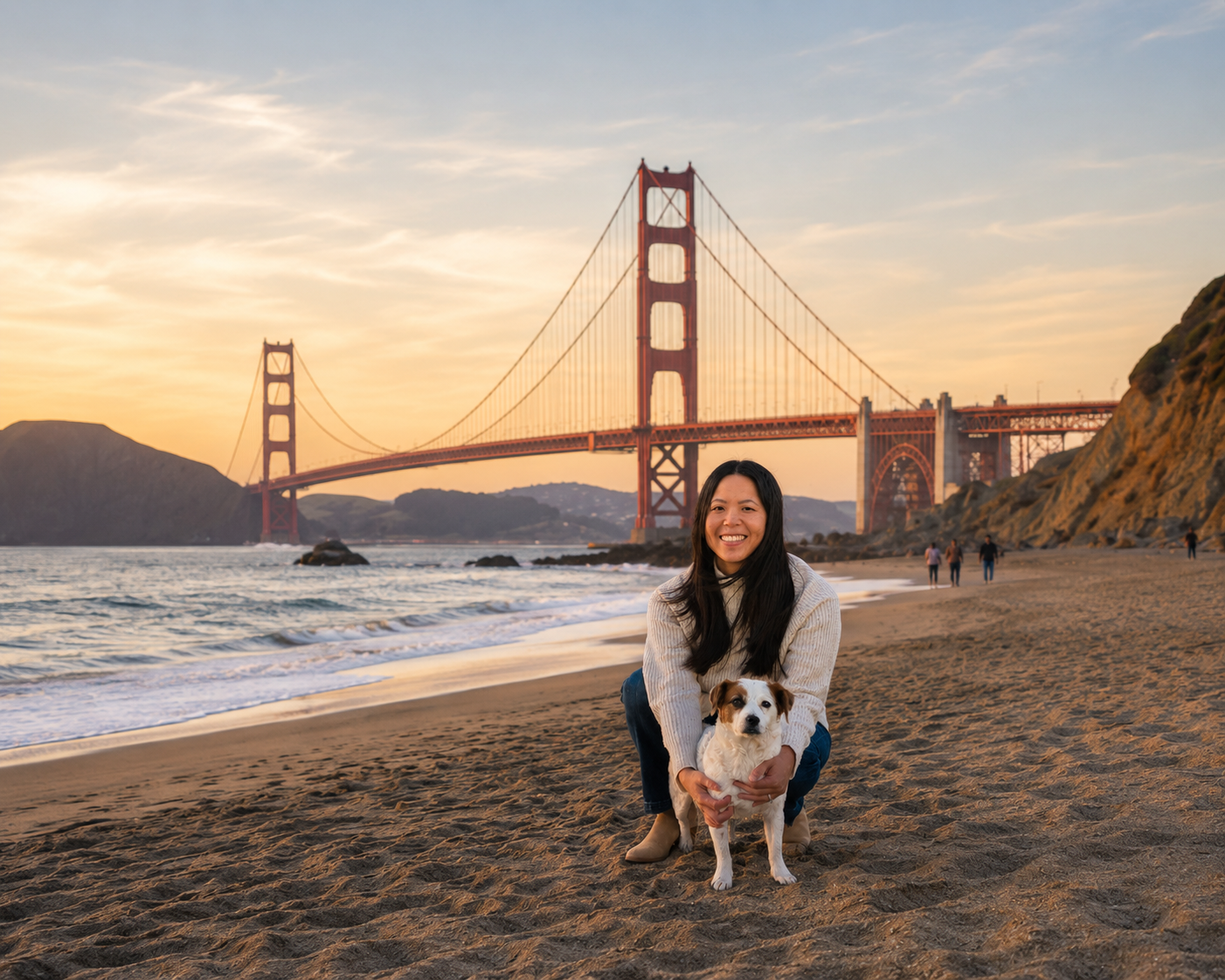 Dr. Elaine Yip, DVM, USDA-accredited veterinarian, with a small dog on the beach near the Golden Gate Bridge